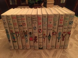 Complete set of 14 Frank Baum Oz books. White cover edition. Printed circa 1965. Sold 12/1/17 - $550.0000