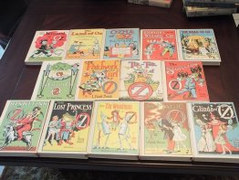 Complete set of 14 Frank Baum Oz books. White cover edition. Printed circa 1965. sold 6-17-15 - $650.0000