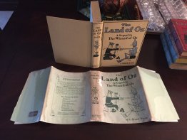 Land of Oz. 1st edition 5th printing in original dust jacket. (c1904)  Circa 1918.