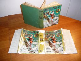Pirates in Oz. 1st edition with 12 color plates in 1st edition dust jacket (c.1931) - $600.0000