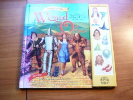 Songs from Wizard of Oz.  1996 edition. Hardcover with press and play songs - $20.0000