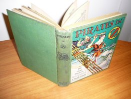 Pirates in Oz. 1st edition with 12 color plates (c.1931). Sold 7/1/2012