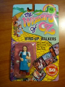 Wizard of Oz Wind-Up Walker - Dorothy as shown on page 253 of Wizard of Oz collectors Treasury. Sold 4/13/2013 - $10.0000