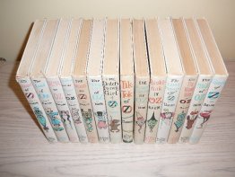 Complete set of 14 Frank Baum Oz books. White cover edition. Printed circa 1965. Sold 12/11/12 - $500.0000