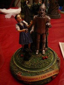 Wizard Of Oz  The Franklin Mint musical sculpture 5 inches high.  Tinman with Dorothy. Hand painted porcelain scene. ( c.1997) - $75.0000