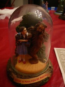 Wizard Of Oz  The Franklin Mint musical sculpture 5 inches high. Cowardly Lion with Dorothy. Hand painted porcelain scene. ( c.1997) - $75.0000