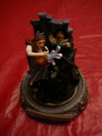 Wizard Of Oz  The Franklin Mint musical sculpture 5 inches high. Melting Witch. Hand painted porcelain scene. ( c.1997) 