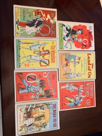 Set of 7 Frank Baum Oz books. White cover edition. Printed circa 1965