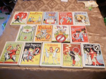 Complete set of 14 Frank Baum Oz books. White cover edition. Printed circa 1965. Sold 1/4/2016 - $800.0000